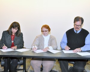 Vicky Wood, Ph.D., Dean of Information Technologies & Business; Deb Gearhart, Ph.D., Vice Provost for eLearning and Strategic Partnerships; and Scott Potter, Dean of Arts & Sciences sign the agreement for the Marion Technical College, Ohio University partnership.