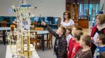 Marion City Schools 4th graders look at a roller coaster model built by Ohio State at Marion engineering students while touring the Marion Campus.