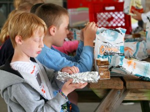 Kids dig into their lunch at the Boys & Girls Club during the 2013 Summer Lunch Program.