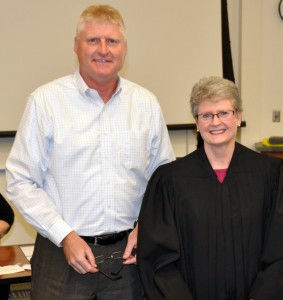 New Trustee Ken Young being sworn in by Judge Deb Alspach.