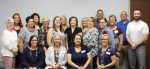 Seated are Modern Woodmen representatives with Marion County Board of Developmental Disabilities staff (standing) that was honored with Hometown Hero Awards